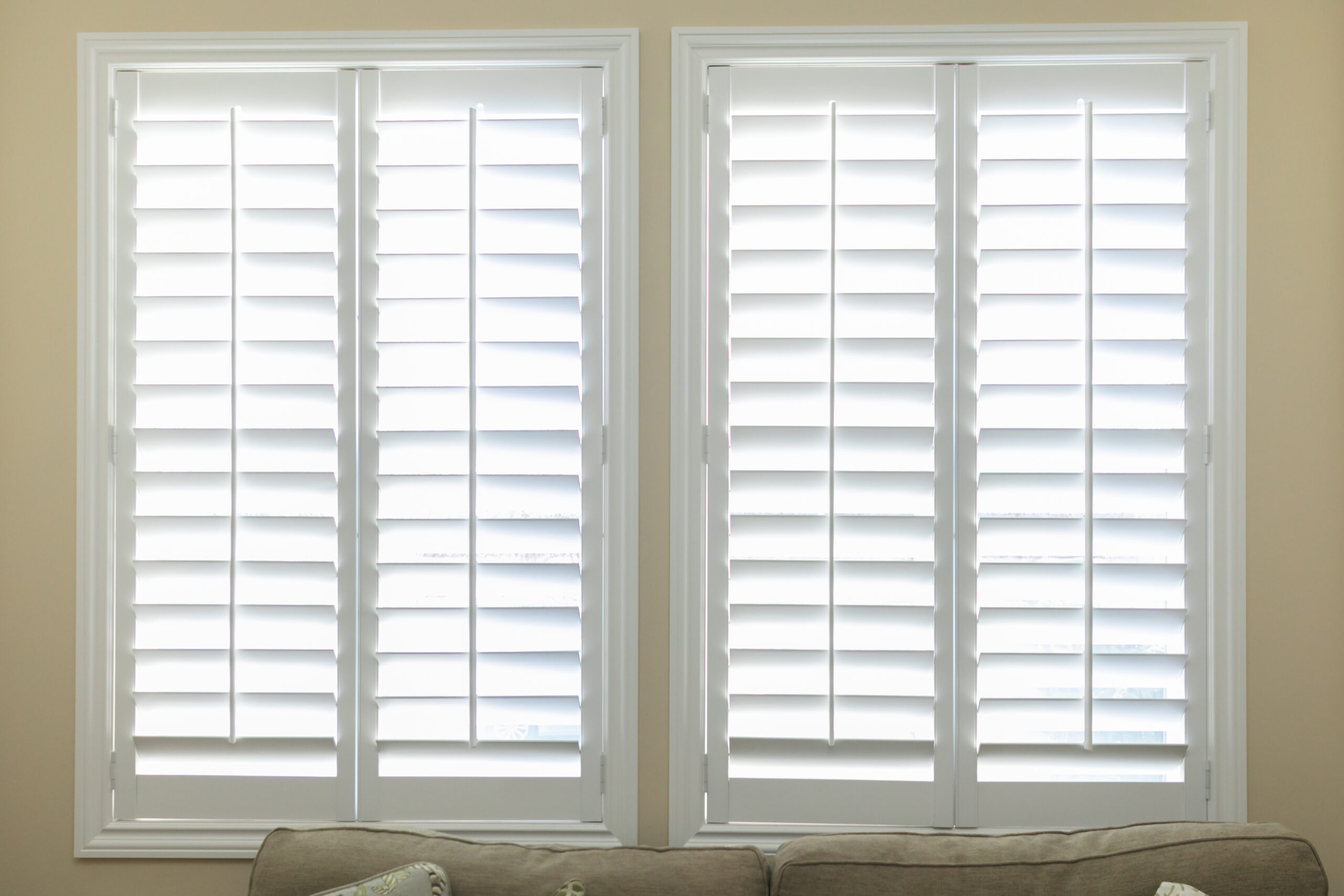 A,Set,Of,Open,White,Plantation,Shutters,In,A,Light
